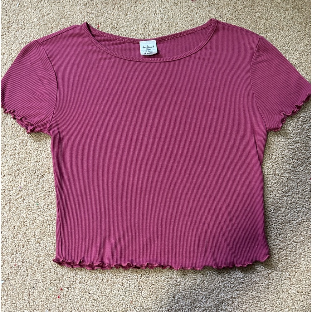 Pink shirt with ruffle details on sleeves and bottom of the shirt!!